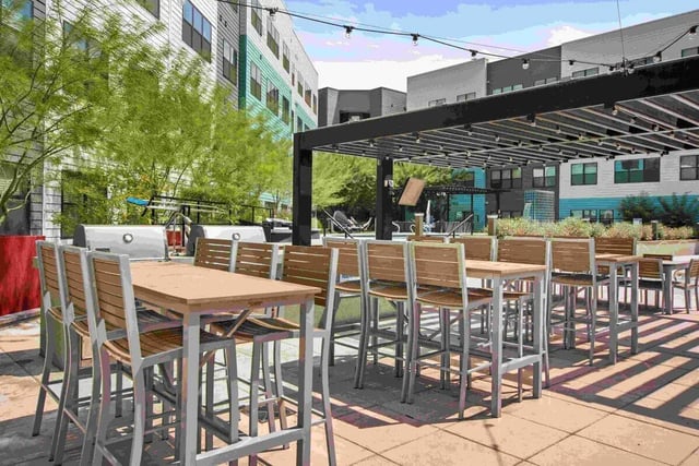Outdoor tables and chairs with grills exterior at Park Place Tempe in Tempe Student Accommodation