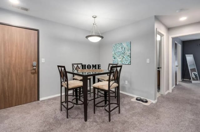 Four chairs and table with decor dining area at Arbor Glen Apartments in East Lansing Student Accommodation