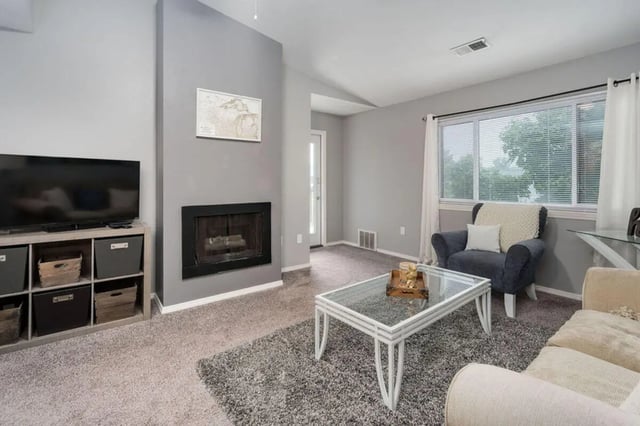 Fireplace TV stand and coffee table living room at Arbor Glen Apartments in East Lansing Student Accommodation