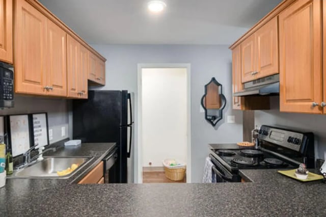 Kitchen cabinets sink refrigerator stove kitchen at Arbor Glen Apartments in East Lansing Student Accommodation