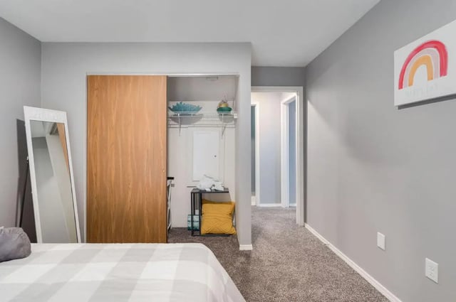 Bed closet mirror and hallway bedroom at Arbor Glen Apartments in East Lansing Student Accommodation