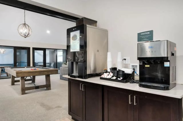 Coffee maker water dispenser pool table lounge area at Arbor Glen Apartments in East Lansing Student Accommodation