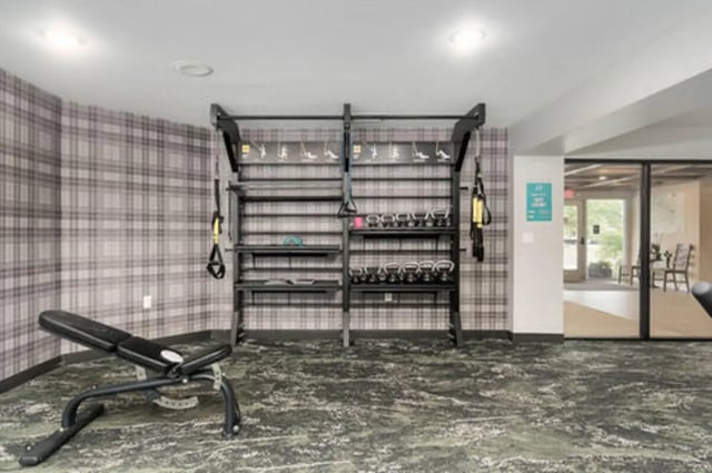 Weight bench rack with kettlebells gym area at Arbor Glen Apartments in East Lansing Student Accommodation