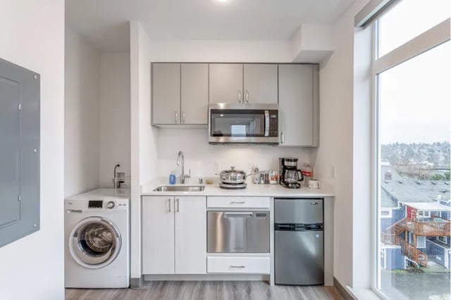 Washer microwave sink dishwasher refrigerator kitchen at Fifty Two Apartments in Seattle Student Accommodation