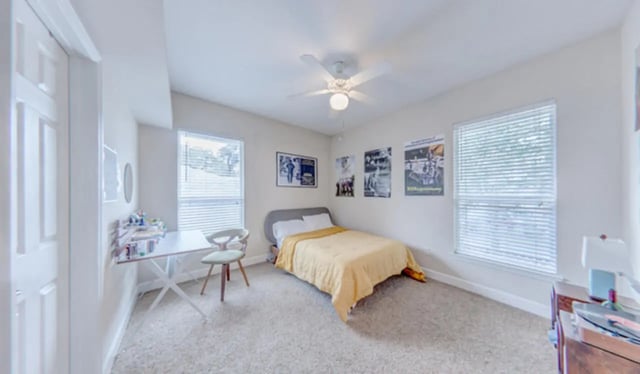 Bed desk chair ceiling fan bedroom at Heritage Oaks Luxury Apartments in Gainesville Student Accommodation