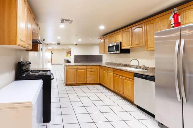 Kitchen with stove refrigerator microwave sink kitchen Image Type at Dixie Cove Student Housing in St. George Student Accommodation