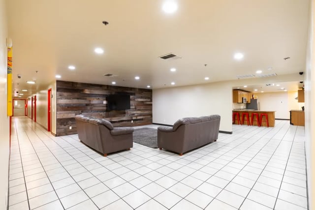 Hallway two sofas TV kitchen and living area at Dixie Cove Student Housing in St. George Student Accommodation