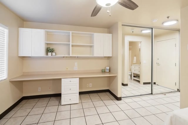 Built-in desk white cabinets mirrored closet Study area at Dixie Cove Student Housing in St. George Student Accommodation
