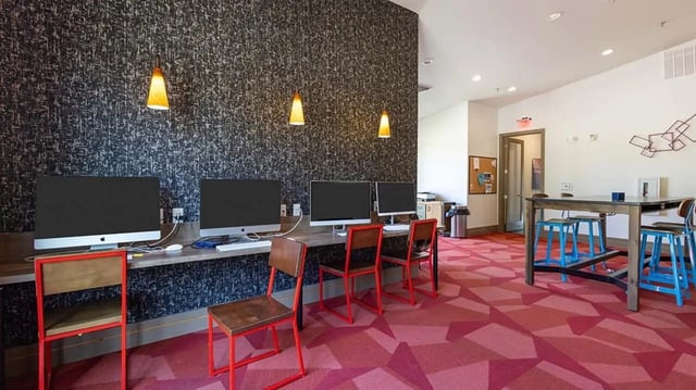 Computers chairs and a table study area at Hawks Landing Apartments in Cape Girardeau Student Accommodation