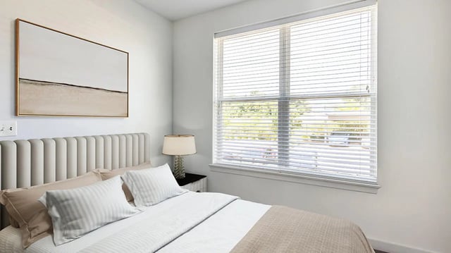 Bed with art painting and lamp bedroom at Hawks Landing Apartments in Cape Girardeau Student Accommodation