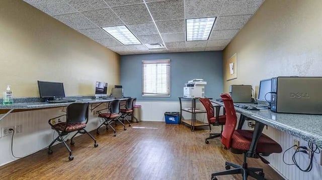 Computers printers and chairs study area at Village at Bluegrass in Mount Pleasant Student Accommodation