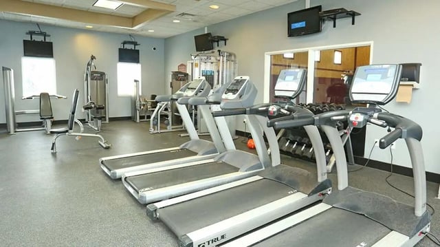 Treadmills and weight machines fitness gym at Village at Bluegrass in Mount Pleasant Student Accommodation