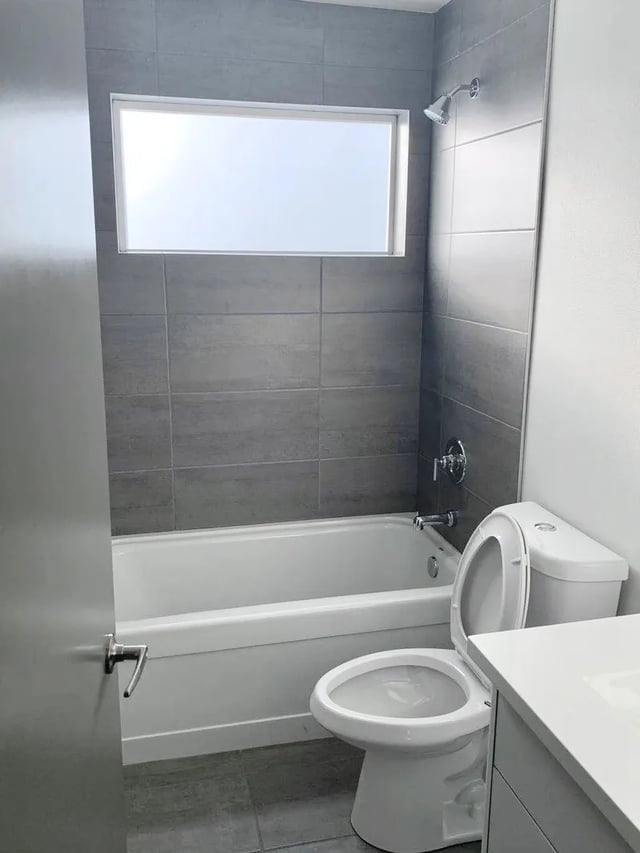 Modern bathroom with bathtub toilet and shower Bathroom at Husky Urban Living in Seattle Student Accommodation