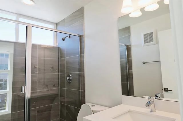 Shower toilet sink and mirror Bathroom at Husky Urban Living in Seattle Student Accommodation