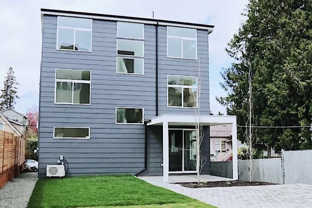 Modern building with gray siding and many windows Exterior at Husky Urban Living in Seattle Student Accommodation