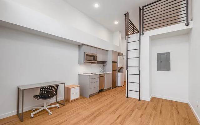Desk microwave refrigerator washer ladder studio at Husky Urban Living in Seattle Student Accommodation