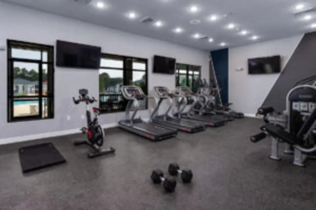 Spin bike treadmills exercise machines dumbbells gym at Preserve at Tech in Ruston Student Accommodation