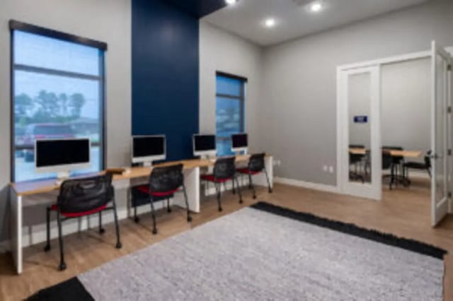 Computers and chairs at desks study area at Preserve at Tech in Ruston Student Accommodation