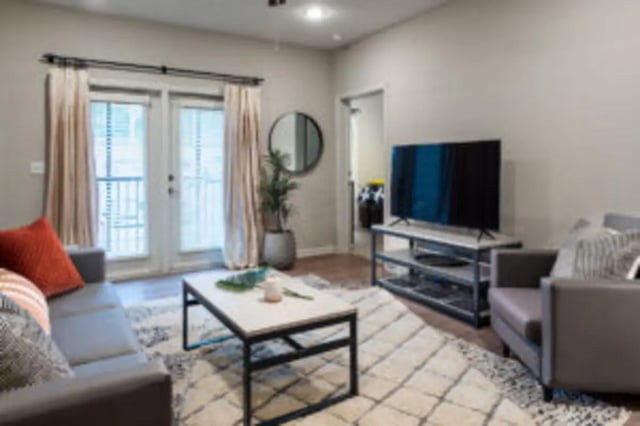 Sofa, coffee table, TV, armchair, living room at Preserve at Tech in Ruston Student Accommodation