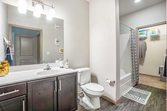 Sink toilet shower and closet bathroom at The Den Apartments in Berkeley Student Accommodation