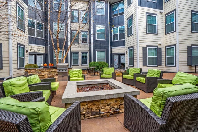 Courtyard fire pit with seating exterior. at The Den Apartments in Berkeley Student Accommodation