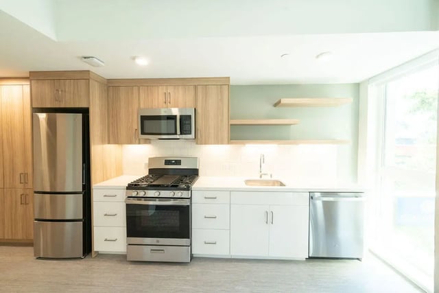 Modern kitchen with stainless steel appliances and white cabinets kitchen at The Kittredge in Berkeley Student Accommodation