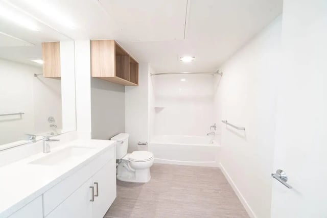 Modern bathroom with sink toilet and tub at The Kittredge in Berkeley Student Accommodation