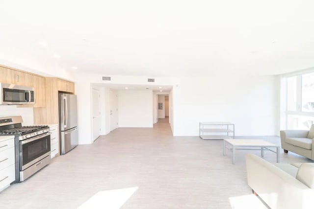 Kitchen appliances furniture and hallway view living room at The Kittredge in Berkeley Student Accommodation