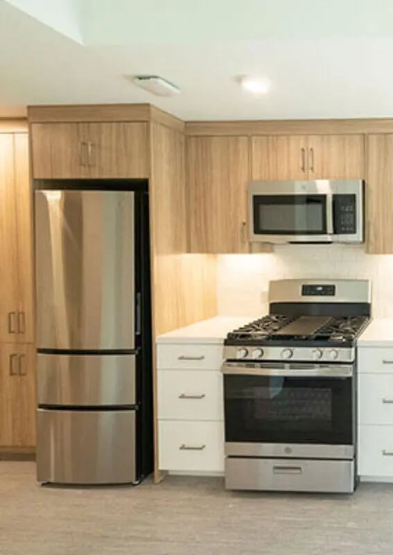 Refrigerator stove microwave white cabinets kitchen at The Kittredge in Berkeley Student Accommodation