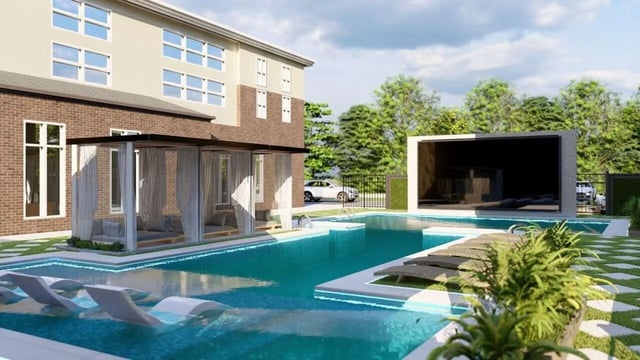 Pool with lounge chairs and outdoor seating area Exterior at Watercress Tuscaloosa in Tuscaloosa Student Accommodation