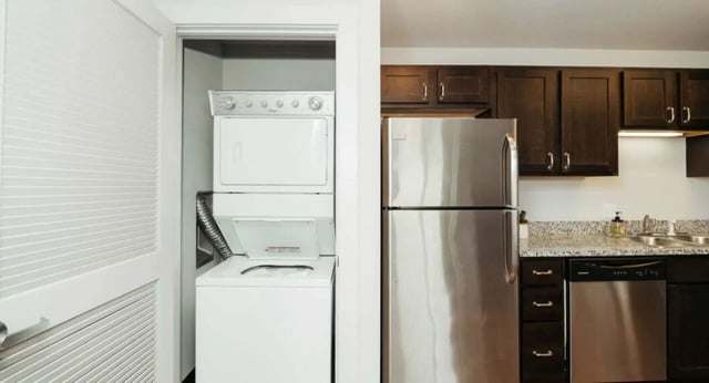 Washer dryer stainless steel refrigerator kitchen at MadisonVue Apartments in Springfield Student Accommodation