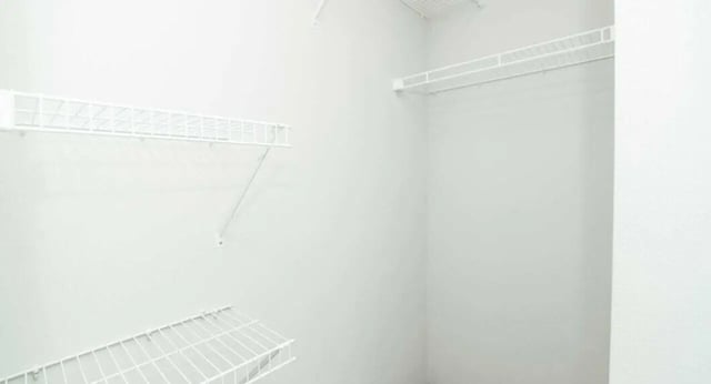 White wire shelves on empty white walls closet at MadisonVue Apartments in Springfield Student Accommodation