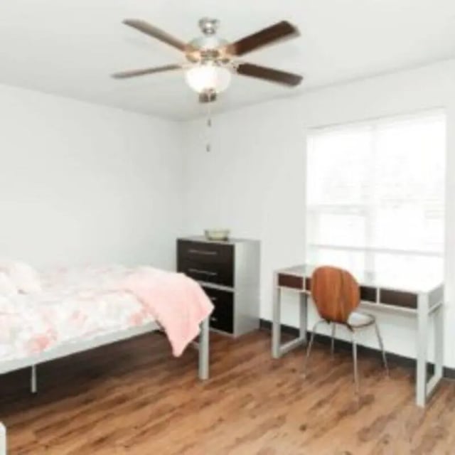 Bed dresser desk and chair bedroom at MadisonVue Apartments in Springfield Student Accommodation