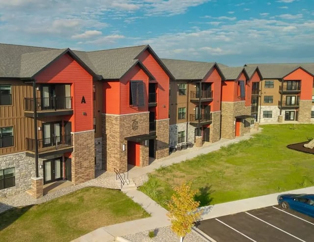 Modern apartment building with balconies and grass exterior at Magers Apartments in Springfield Student Accommodation