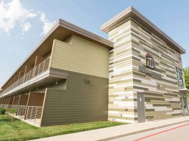 Modern building with balconies and colorful siding exterior at Magers Apartments in Springfield Student Accommodation