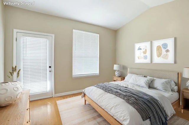 Bed with white bedding and grey throw Bedroom at Stadium Properties Apartments in Tallahassee Student Accommodation