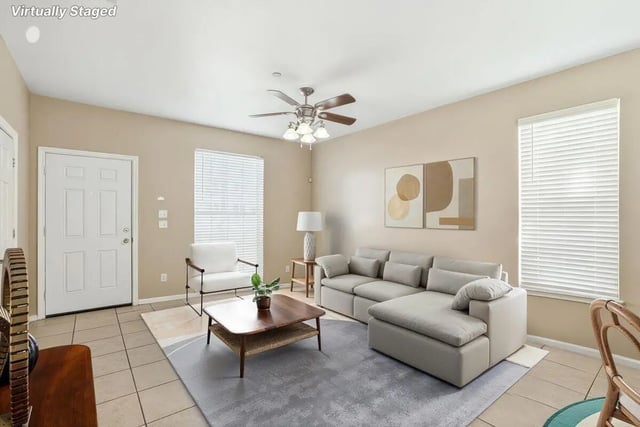 Sofa chair coffee table artwork living room at Stadium Properties Apartments in Tallahassee Student Accommodation