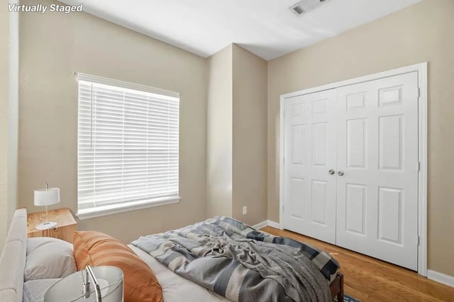Bed window closet and pillows bedroom at Stadium Properties Apartments in Tallahassee Student Accommodation