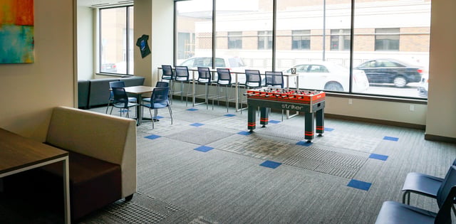 Foosball table couches bar chairs and table lounge at Highland Quarters in Terre Haute Student Accommodation