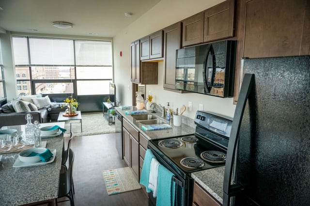 Kitchen with dining area and living room view. at Highland Quarters in Terre Haute Student Accommodation