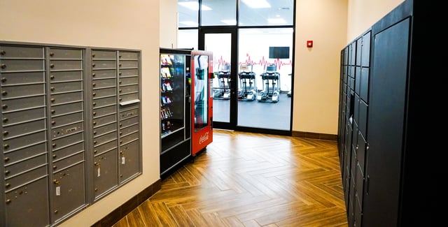 Mailboxes vending machine lockers gym entrance exterior at Highland Quarters in Terre Haute Student Accommodation