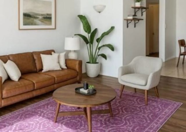 Brown leather sofa, arm chair, wood coffee table living room at Villa Bella Vista in Tallahassee Student Accommodation