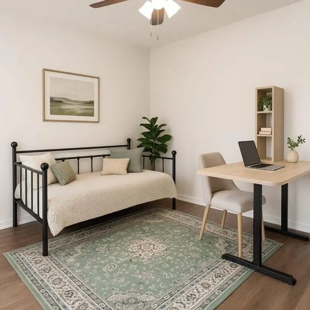 Daybed desk chair bookshelf plant artwork bedroom at Villa Bella Vista in Tallahassee Student Accommodation
