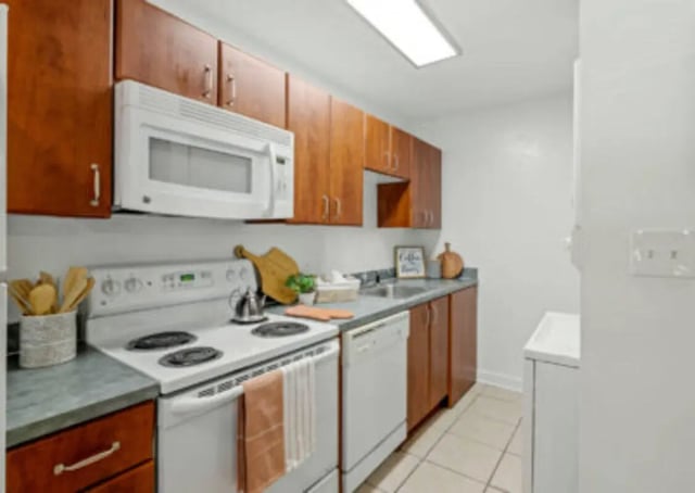 White stove microwave dishwasher cabinets kitchen at Villa Cristina in Tallahassee Student Accommodation