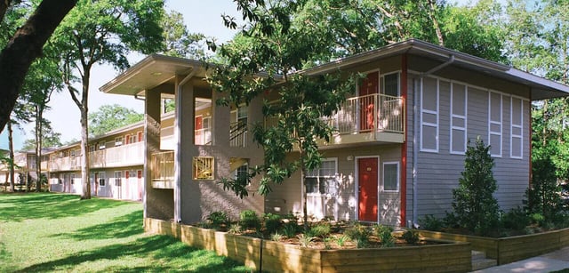 Apartment building with balconies and red doors exterior at Villa Cristina in Tallahassee Student Accommodation