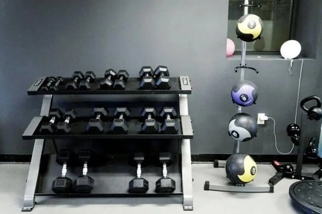 Dumbbells medicine balls kettlebells gym equipment gym at The Legacy at Drexel Arms Apartments in Philadelphia Student Accommodation