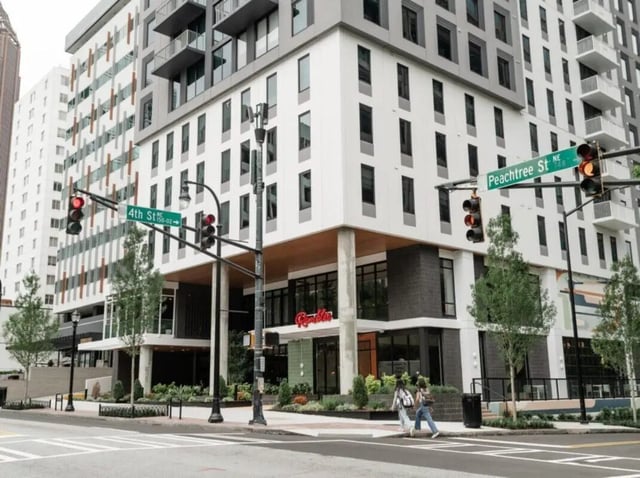 Modern apartment building with street signs exterior at Rambler Atlanta Apartments in Atlanta Student Accommodation