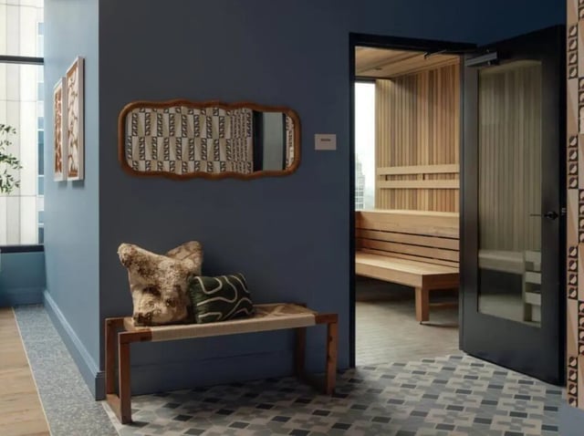 Wooden bench with pillows leads to sauna room at Rambler Atlanta Apartments in Atlanta Student Accommodation
