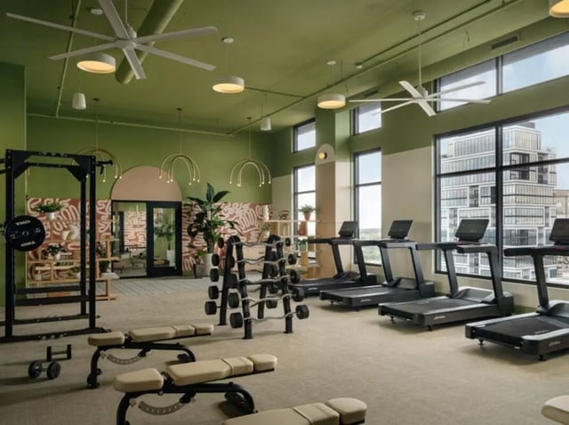 Gym equipment treadmills weight rack benches gymnasium at Rambler Atlanta Apartments in Atlanta Student Accommodation