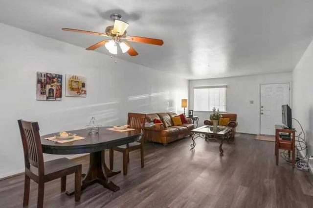 Dining table leather sofas coffee table living room at University Terrace Apartments in State College Student Accommodation